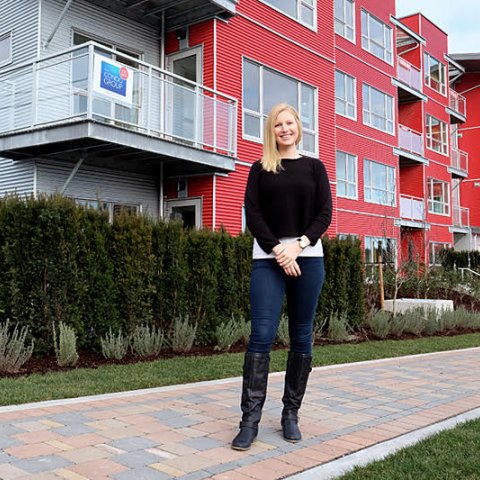 Tiara Pettinger in front of her new condo at Bond's Landing.
